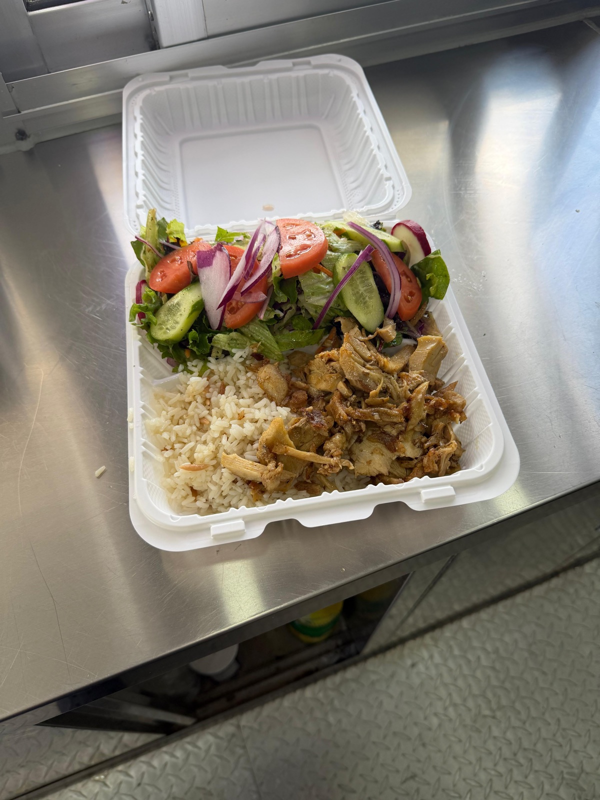 Chicken gyro plate with rice and salad